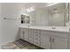 Bright bathroom featuring double sinks, a large mirror, and modern fixtures at 460 W Chase St, San Tan Valley, AZ 85143