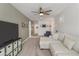 Spacious living room featuring a plush sectional sofa, entertainment center, and neutral decor at 460 W Chase St, San Tan Valley, AZ 85143