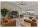 Inviting living room boasts a vaulted ceiling, a large window, and sliding doors to the back patio at 460 W Chase St, San Tan Valley, AZ 85143