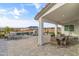 Covered patio features an outdoor dining area and seating, perfect for entertaining at 460 W Chase St, San Tan Valley, AZ 85143