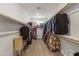 Organized walk-in closet with ample hanging space and shelving for clothing and storage at 460 W Chase St, San Tan Valley, AZ 85143