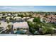 An aerial view of a home in a vibrant community surrounded by lush landscaping and serene desert views at 462 N Bedford Ct, Chandler, AZ 85225