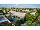 An aerial view of a well-maintained house with a diving pool, outdoor seating area, and lush landscaping at 462 N Bedford Ct, Chandler, AZ 85225