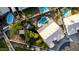 An aerial view of a backyard with an in-ground diving pool, a hot tub, a small pond, and mature landscaping at 462 N Bedford Ct, Chandler, AZ 85225