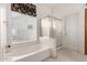 Bright bathroom with garden tub, separate shower, and large window for natural light at 462 N Bedford Ct, Chandler, AZ 85225