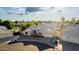 An elevated view of a well-maintained single-story home and mature landscaping with a circular drive and front yard fountain at 462 N Bedford Ct, Chandler, AZ 85225