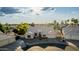 An elevated view of a well-maintained single-story home and mature landscaping with a circular drive and front yard fountain at 462 N Bedford Ct, Chandler, AZ 85225