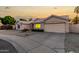Inviting single-story home with mature desert landscaping and attached two-car garage and circle driveway at 462 N Bedford Ct, Chandler, AZ 85225