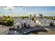 An elevated view of a well-maintained single-story home and mature landscaping with a circular drive and front yard fountain at 462 N Bedford Ct, Chandler, AZ 85225
