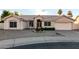 Beautiful single-story home with desert landscaping, fountain, and attached two-car garage at golden hour at 462 N Bedford Ct, Chandler, AZ 85225