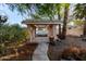 View of a covered gazebo with a tile roof, columns, and stone walkway surrounded by landscaping at 462 N Bedford Ct, Chandler, AZ 85225