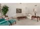 Bright living room with plush sofa, chairs, and a decorative painting at 462 N Bedford Ct, Chandler, AZ 85225