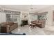 Comfortable living room with sofas, fireplace, and views to outdoor space at 462 N Bedford Ct, Chandler, AZ 85225