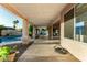 Covered patio featuring long decorative columns overlooking desert landscape and pool at 462 N Bedford Ct, Chandler, AZ 85225