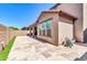 Backyard showcasing a paved patio, minimal grass, and exterior stucco walls for low maintenance landscaping at 550 E Zion Pl, Chandler, AZ 85249