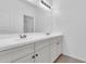 Bright bathroom featuring a double sink vanity with white cabinets and a large mirror at 550 E Zion Pl, Chandler, AZ 85249
