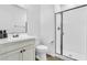 Clean bathroom with white vanity, toilet, and glass-enclosed shower, perfect for modern living at 550 E Zion Pl, Chandler, AZ 85249