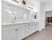 Bright bathroom with double vanity, large mirror, and a clear view of the shower and walk-in closet at 550 E Zion Pl, Chandler, AZ 85249