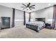 This bedroom features gray walls, and a ceiling fan, along with nice size windows with blinds at 550 E Zion Pl, Chandler, AZ 85249