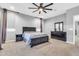 This bedroom features a ceiling fan, and gray walls, along with nice size windows with blinds at 550 E Zion Pl, Chandler, AZ 85249