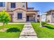 Inviting home exterior showcasing a meticulously maintained lawn and a pathway to the front door at 550 E Zion Pl, Chandler, AZ 85249