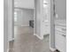 Hallway showcasing the tile flooring leading to a bathroom and living area at 550 E Zion Pl, Chandler, AZ 85249