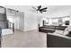 Spacious living room with a staircase and an open-concept view of the kitchen at 550 E Zion Pl, Chandler, AZ 85249