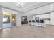 Open-concept kitchen and living space with a sliding glass door to the outdoor patio at 550 E Zion Pl, Chandler, AZ 85249