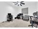 Home office setup with multiple desks, chairs, and a ceiling fan for added comfort at 550 E Zion Pl, Chandler, AZ 85249