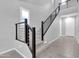 Modern staircase with carpeted steps and sleek metal railing in a neutrally decorated, well-lit home interior at 550 E Zion Pl, Chandler, AZ 85249