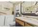Stylish bathroom featuring a walk-in tub, vanity, and elegant fixtures for a relaxing experience at 6247 E Albany St, Mesa, AZ 85205