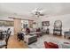 A cozy living room with hardwood floors, a comfortable sofa, and charming rustic sliding barn doors at 6247 E Albany St, Mesa, AZ 85205