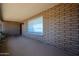 Charming front porch with brick accents, a window for natural light, and a welcoming entrance at 6449 E Ellis St, Mesa, AZ 85205