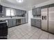 Gray kitchen features updated stainless steel appliances and stylish countertops at 6449 E Ellis St, Mesa, AZ 85205