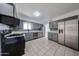 Kitchen features stainless appliances and a mosaic backsplash at 6449 E Ellis St, Mesa, AZ 85205