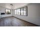 Spacious sunroom featuring many windows and vinyl plank flooring at 6449 E Ellis St, Mesa, AZ 85205