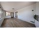 Bright sunroom featuring painted brick wall and new flooring at 6449 E Ellis St, Mesa, AZ 85205