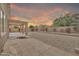 Spacious backyard with a covered patio and desert landscaping, perfect for outdoor entertaining at 7207 W Alta Vista Rd, Laveen, AZ 85339