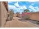 Fully fenced backyard with desert landscaping, patio, and AC unit at 7207 W Alta Vista Rd, Laveen, AZ 85339