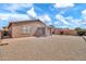 Spacious backyard featuring a covered patio and desert landscaping at 7207 W Alta Vista Rd, Laveen, AZ 85339