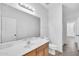 Bathroom vanity with bright countertop, tile floors, and large mirror at 7207 W Alta Vista Rd, Laveen, AZ 85339