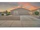 Charming single-story home featuring a two-car garage and low-maintenance landscaping at 7207 W Alta Vista Rd, Laveen, AZ 85339