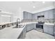 Well-lit kitchen featuring stainless steel appliances, light countertops and mosaic tile backsplash at 7207 W Alta Vista Rd, Laveen, AZ 85339