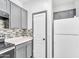 Kitchen with stainless steel oven, gray cabinetry, and subway tile backsplash at 7207 W Alta Vista Rd, Laveen, AZ 85339