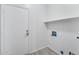 Utility Room including washer and dryer hook-ups with modern flooring at 7207 W Alta Vista Rd, Laveen, AZ 85339