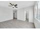 Large main bedroom with attached bathroom, features tile floors, and neutral walls at 7207 W Alta Vista Rd, Laveen, AZ 85339