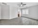 A bright, airy main bedroom with tile floors, connecting bathroom, and a neutral color palette at 7207 W Alta Vista Rd, Laveen, AZ 85339