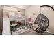 Playful bedroom with a lofted bed, slide, hanging chair, desk, and carpeted floor at 7826 W Mcrae Way, Glendale, AZ 85308
