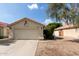 Charming single-story home featuring a red tile roof, two-car garage, and low-maintenance front yard at 7826 W Mcrae Way, Glendale, AZ 85308