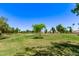 Picturesque golf course highlighting manicured green spaces, natural landscapes, and residential homes in the background at 7826 W Mcrae Way, Glendale, AZ 85308